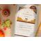 A cute hamster eating while amidst a pile of autumn leaves, printed on a notecard. Slots and tabs for notes and doubles as a bookmark. 